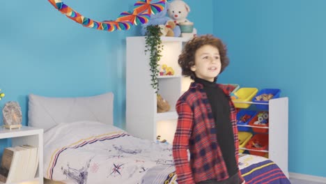 Happy-kid-dancing-in-modern-kids-room.
